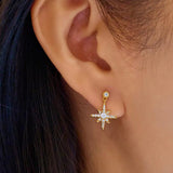 Gold Dangling Nova Star Earrings
