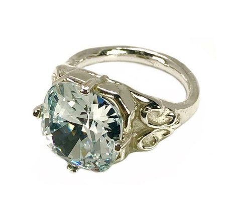 Sterling Silver with Swarovski Crystal. We have this ring in stock with Azore Blue Crystal and size 7.00. Ring is available to order in all 12 months crystal and sizes 5.00 to 10.00. only whole size.