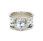 Sterling Silver Hammered Wide Band with Clear April Swarovski Crystal. This Ring is Also available to order in 14K Gold Plated over Sterling Silver. We have what is listed below in stock. We can order different sizes 5 to 10 and stone Color. This Ring is Size 7.00.