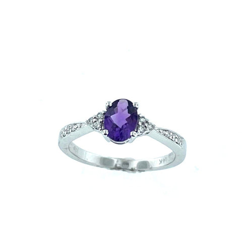 .60 carat Checkerboard Oval Amethyst with .08 Diamonds on sides and in band. Ring set in 14 karat White Gold. Ring Size 7.00