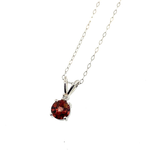 .61 Round Checkerboard Garnet with  .01 Diamond accent pendant set in 14K white gold and hanging on 18" 14K white gold pendant chain