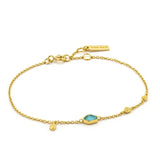 Featuring a turquoise disc, this delicate gold chain bracelet will make a welcome stylish addition to any outfit. Give your wardrobe an update with this piece from Mineral Glow collection. These color-pop pieces feature vibrant turquoise hues and a kaleidoscope of opal colors, making them the perfect standout pieces.  • Material: 14kt gold plated on sterling silver • Bracelet length: 6.50 inches with 1 inch extender • Disc size: 5mm x 6mm • Weight: 1.4g