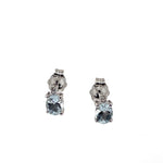 .50 total carat Aquamarine and .07 total carat Diamonds set in 14 Karat white gold stud earrings