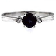 .57 carat Round Checkerboard cut Created Alexandrite with .03 carat Diamonds set in 14 karat white gold. Ring size is 7.00