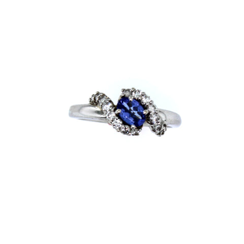 .60 carat Genuine Oval Tanzanite with .35 carat Diamonds set in 14 karat White gold . Ring Size 7.00
