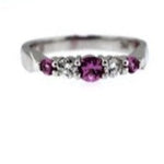 .45 carat Pink Sapphire and .15 carat in Diamonds Band, This Ring size is 7.00 set in 14 karat White Gold.