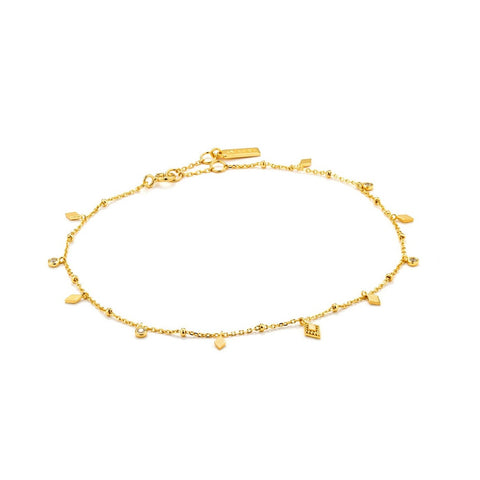 Exude effortless bohemian style with this minimal gold anklet. Featuring delicate cubic zirconia stones, this anklet is the piece your summer outfits have been missing. This anklet is in the Bohemia collection.  • Material: 14kt gold plated on sterling silver • Anklet length: 9 inches with 2 inch extender • Weight: 1.9g